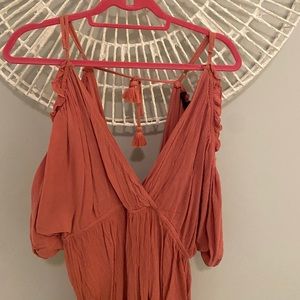 low cut burnt orange/salmon colored romper